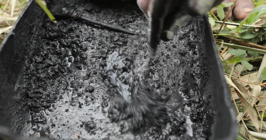 A person stirring goo