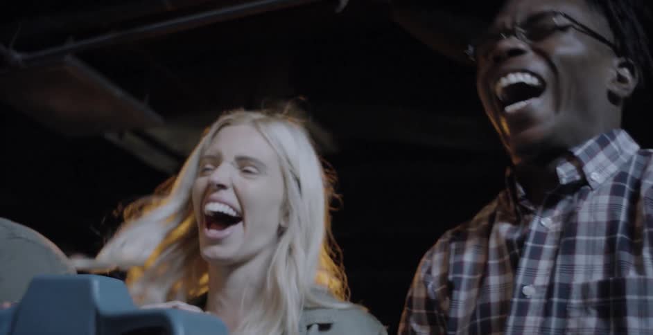 A man and woman laugh together