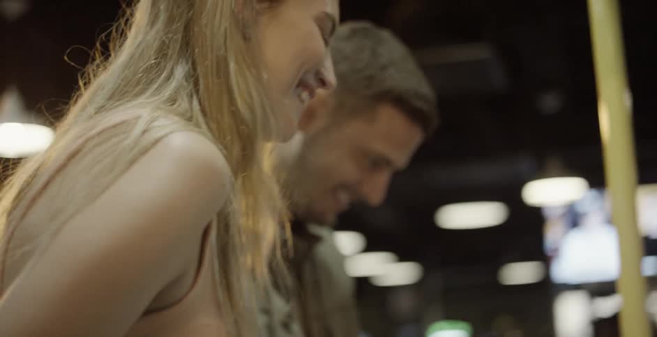 4 people playing at an arcade