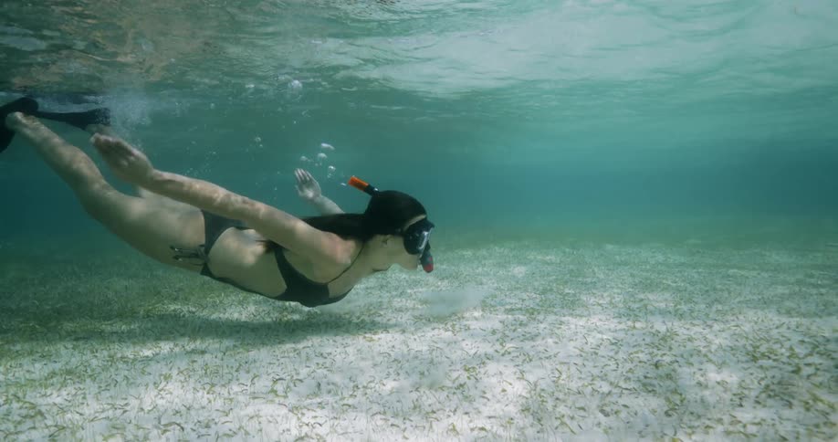 A woman swimming under water