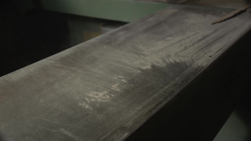 Dust being blown off of a piece of wood