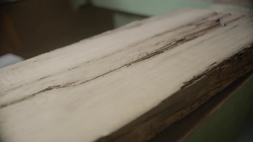 View of the cracked surface of timber in the daytime