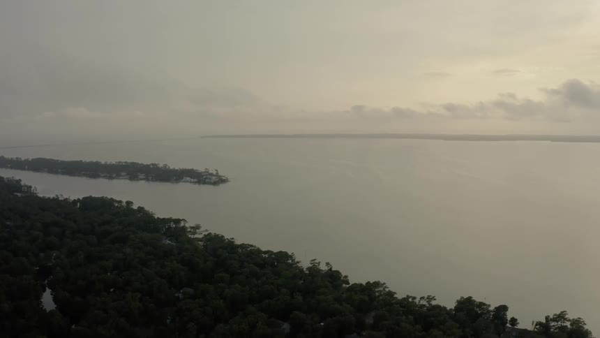 Aerial view of a large river on a tropical area