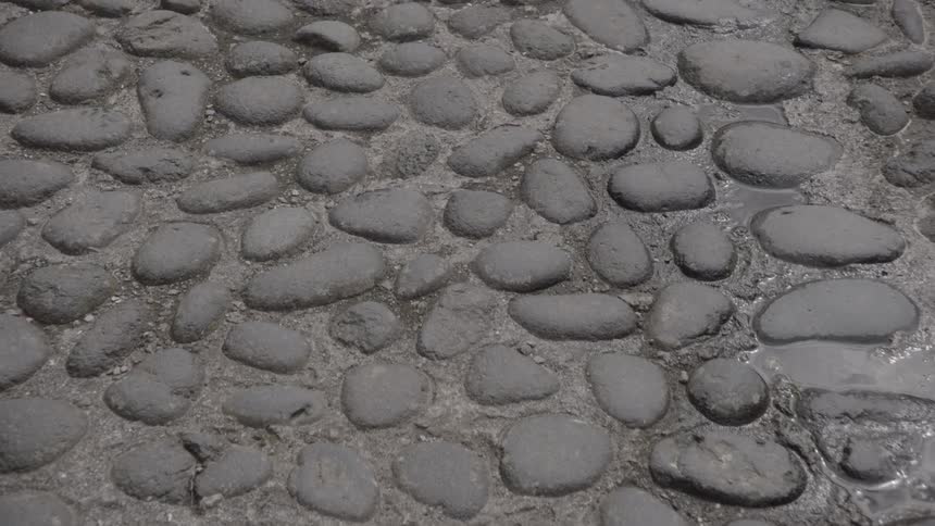 Damp cobblestones in the sun