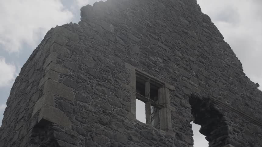 The dilapidated facade of a ruined building