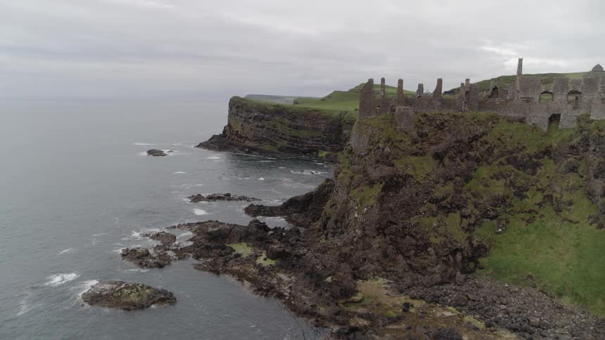 The partially standing walls of an ancient monument on the coast