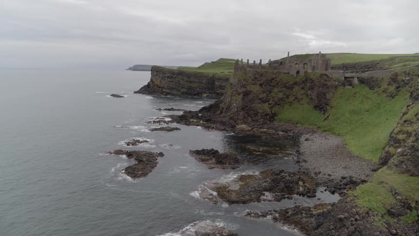 Flying away from a rustic castle on a cliff