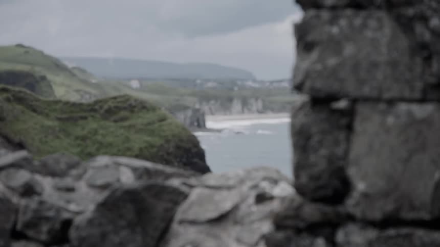 Stones in a stone wall on a cliff above the ocean