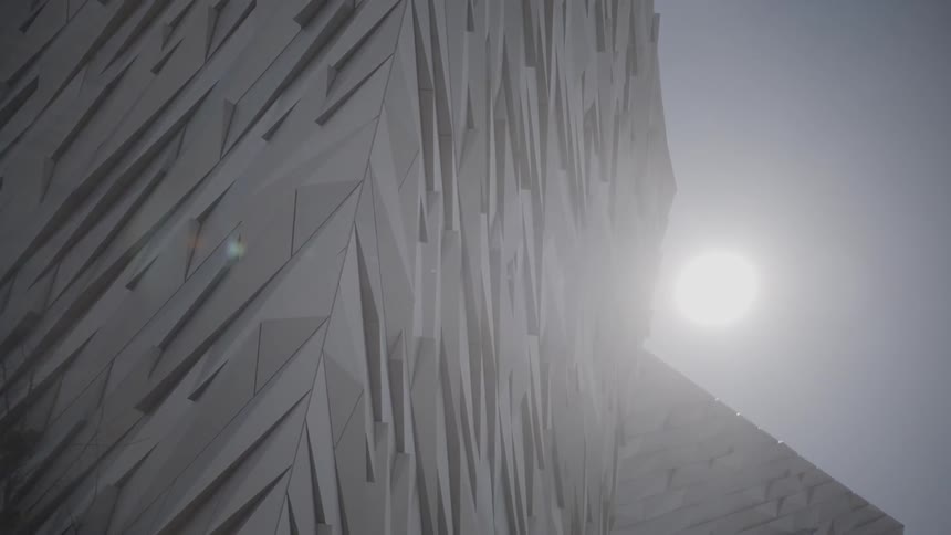 A tall angular and stylish building under the sun
