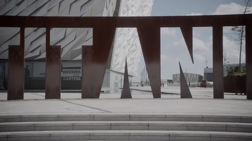 A large architectural titanic sign and modern museum