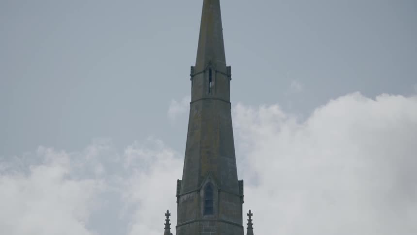 A steeple rises into the sky