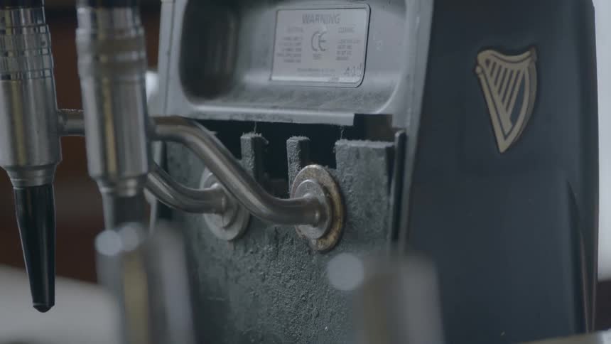 A beer tap that has two heads on it
