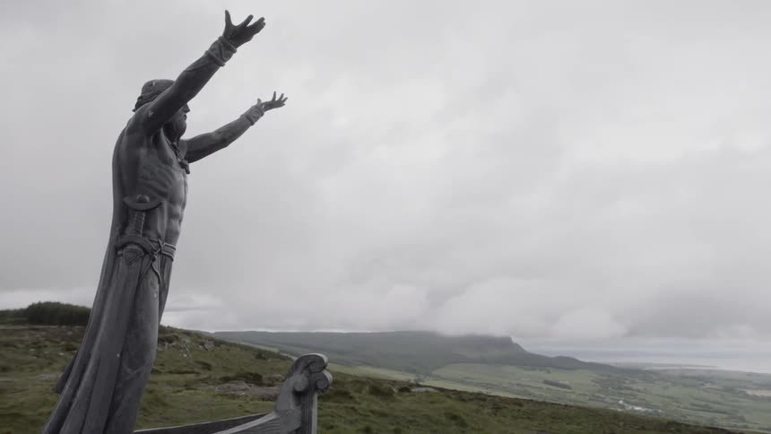 A statue looks over the land