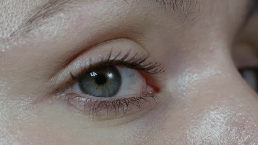 A woman closes her eye