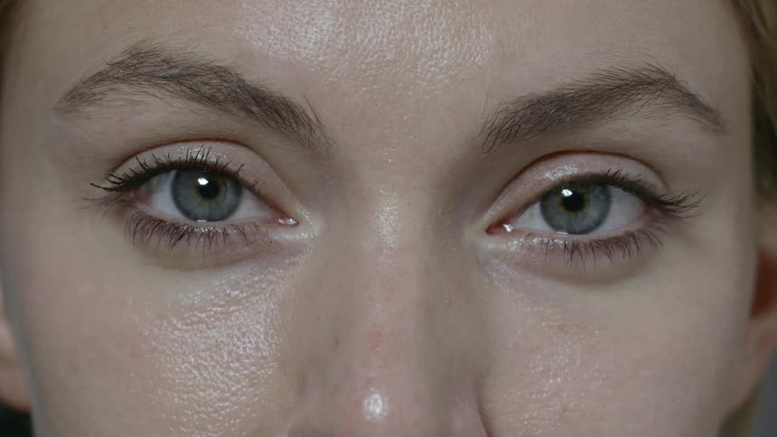 A female with blue eyes staring straight ahead