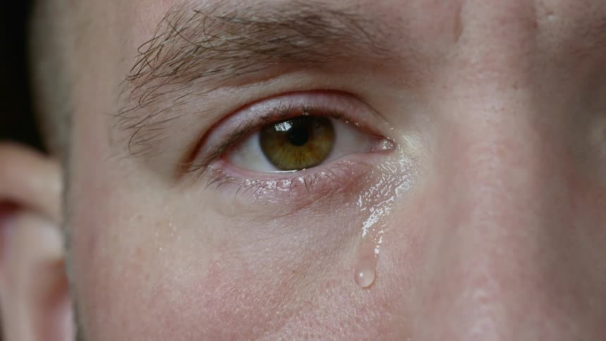 A man with brown eyes crying