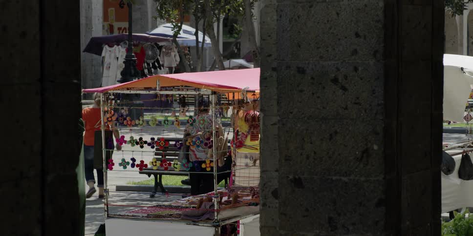 Women shop in an outdoor marketplace in the city