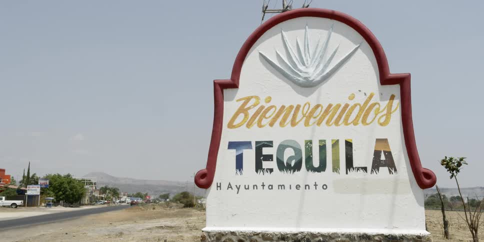 A sign for the city of tequila in mexico on the side of a road