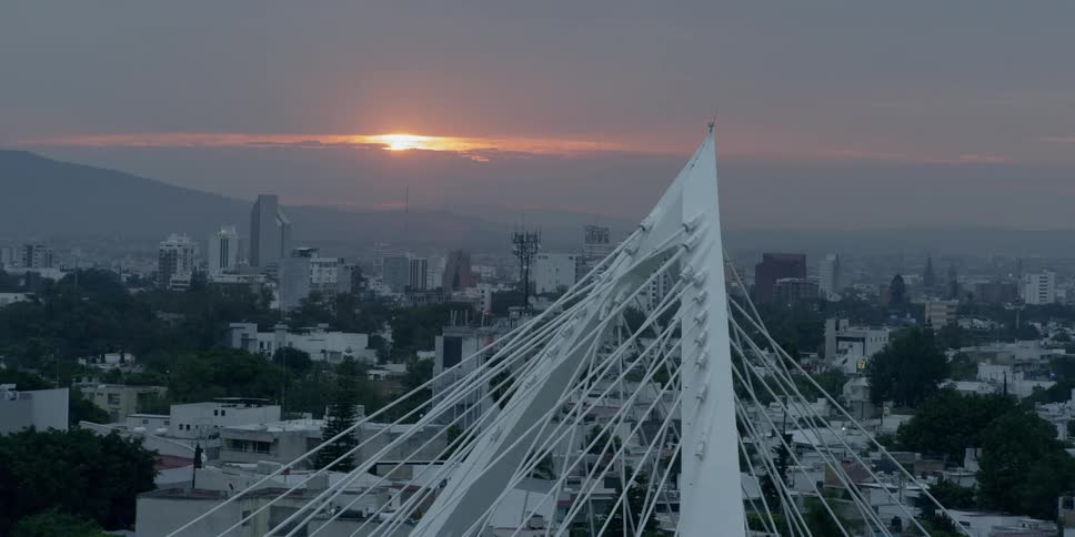 Skyline view of a city with an artistic sculpture in it