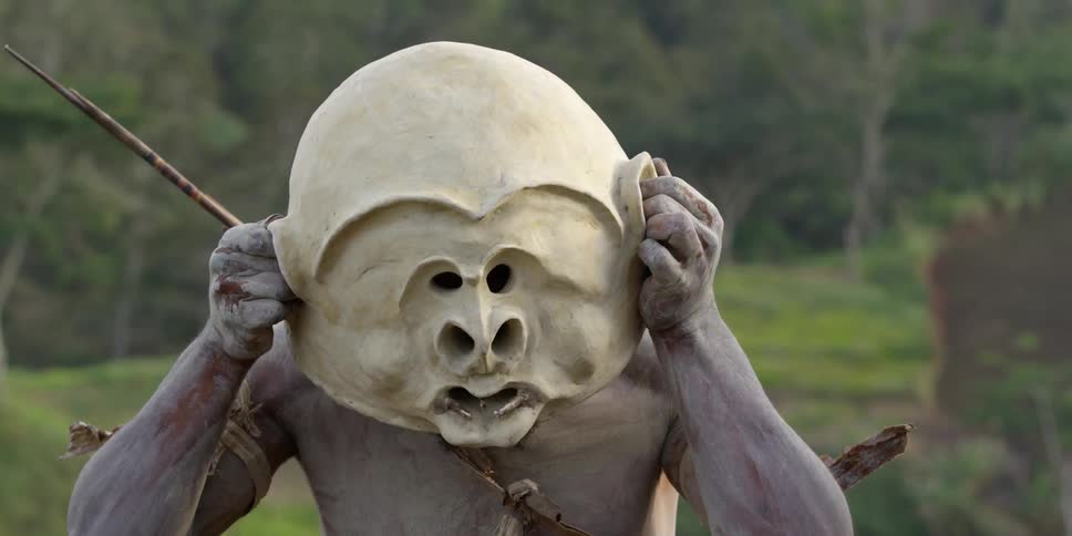 A person putting on a mask