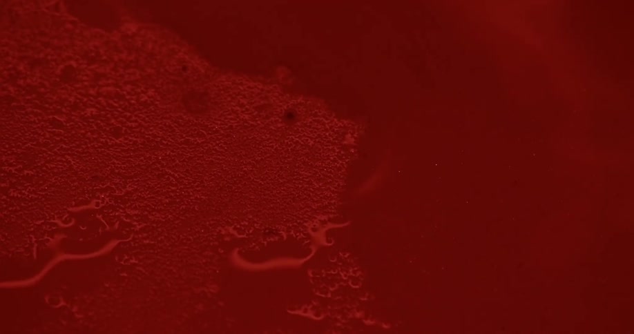 Water pools then flows and covers a red surface