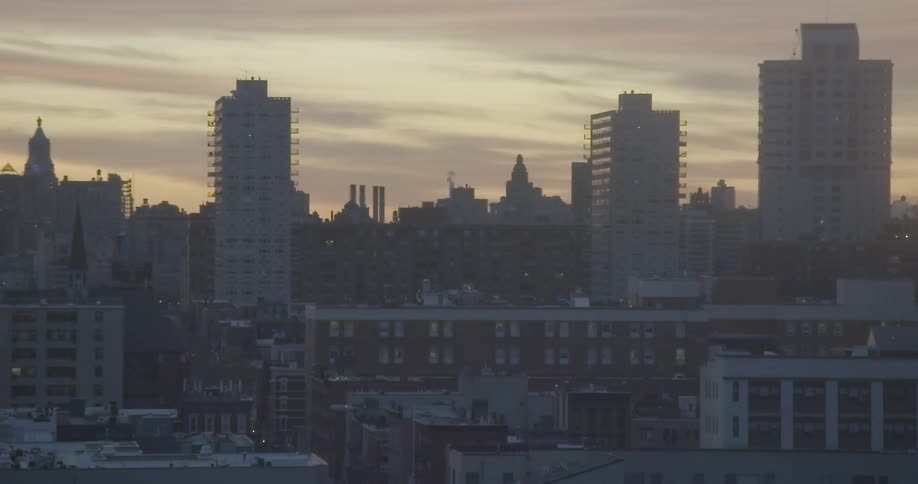 The skyline of a city at sunrise