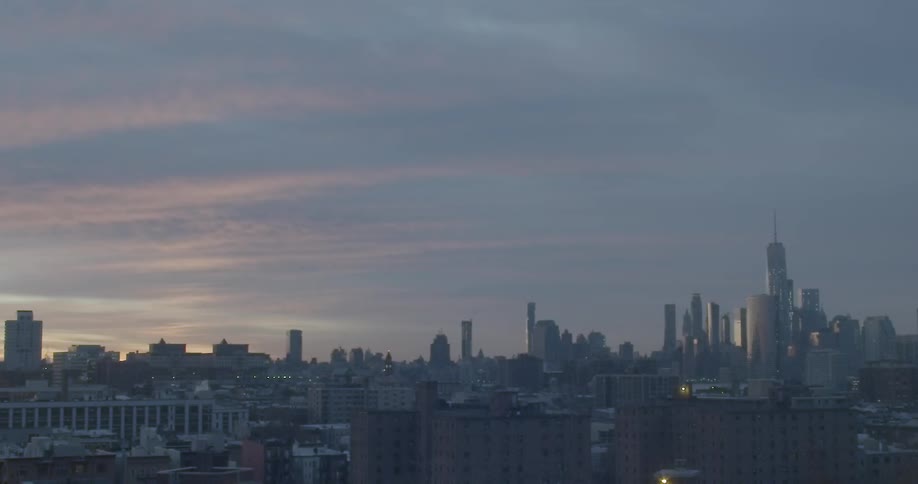 A city skyline under a cloudy sky