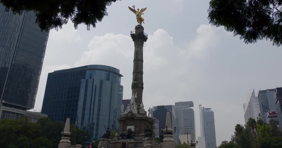 The golden angel of independence statue on top of a column in downtown mexico city