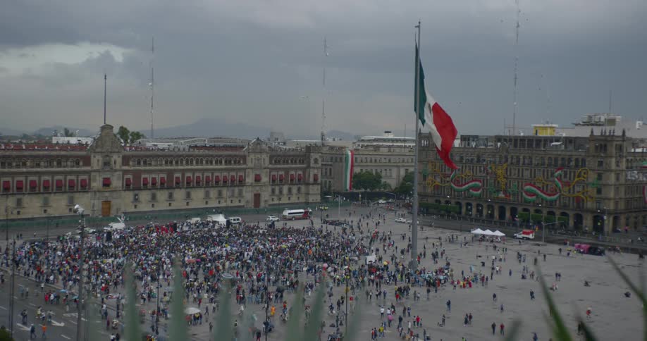 A group gathers in a city square in mexico