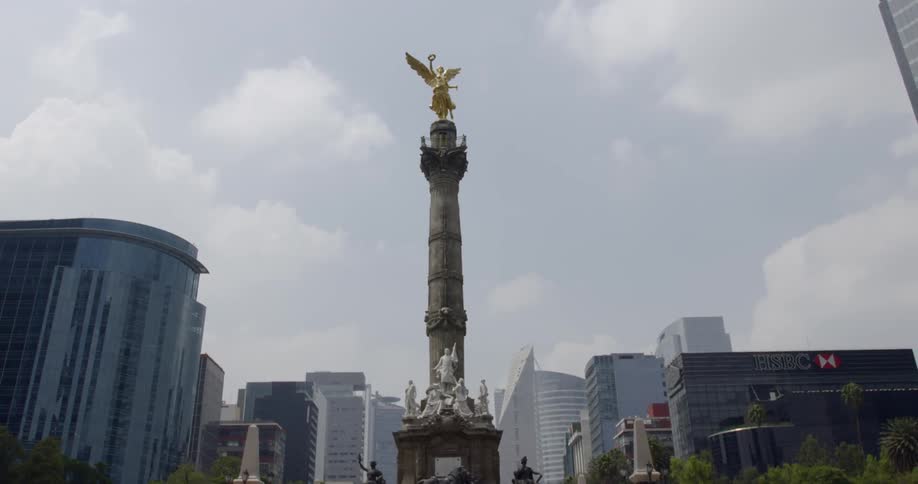 A pillar stands in the center of a large city