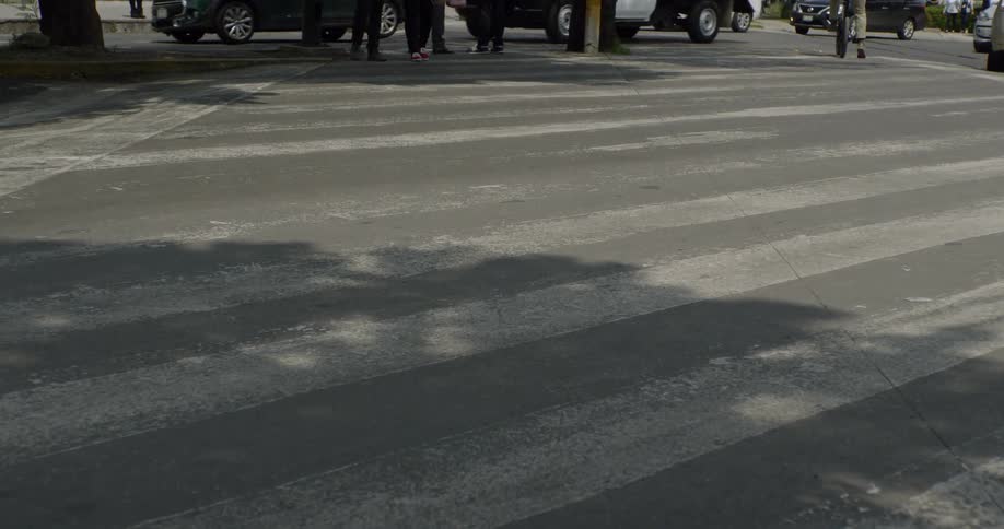 Cars go across a cross walk