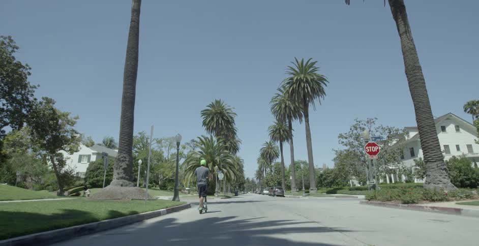 A person is riding a scooter outdoors
