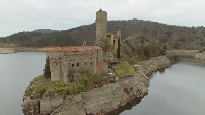Buildings on a rock surrounded by water