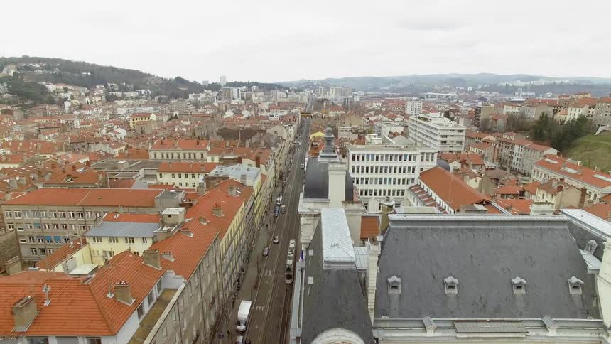 An old city center with traffic moving down a main road