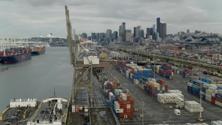 Freighters and shipping containers at docks near downtown