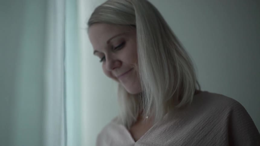 A pregnant woman holding her belly
