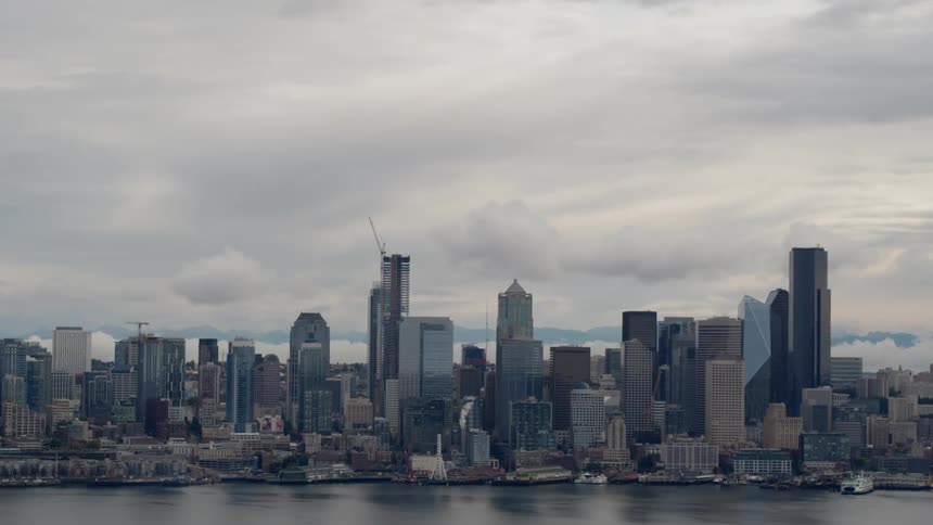 Clouds drift over a large city