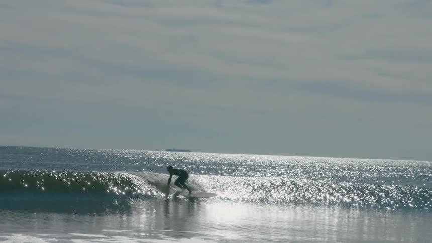 A person surfing on an ocean wave