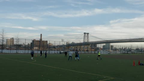 Young men practicing on a soccer field