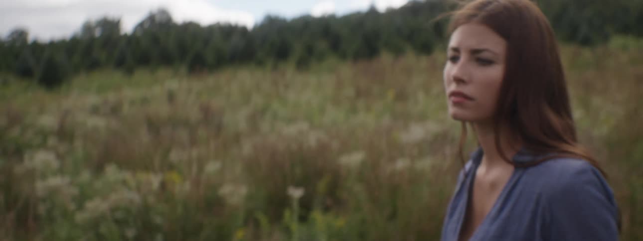 A woman walking in a field
