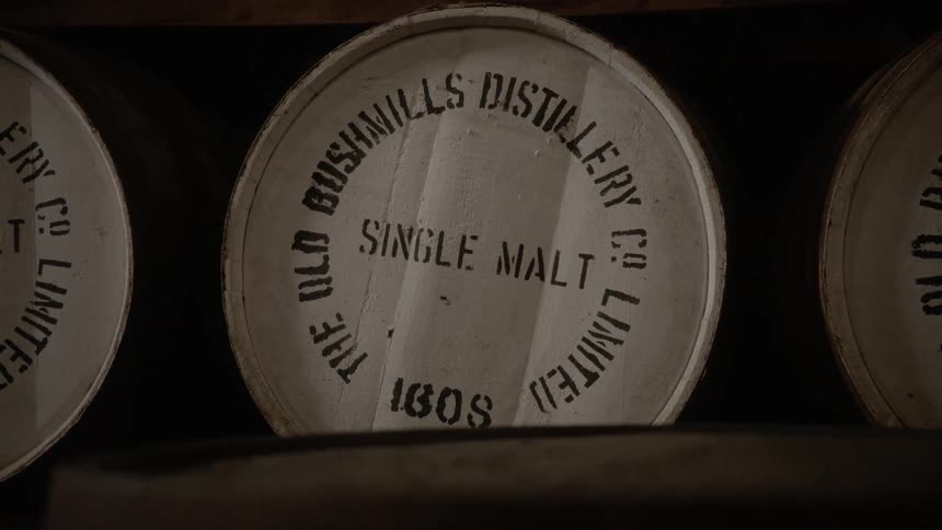 Barrels sit on a rack