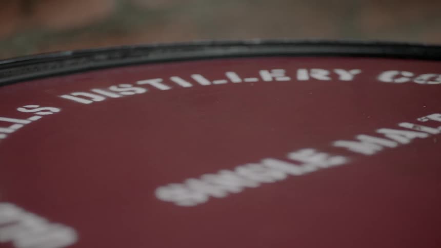 The barrel has a label with writing on it