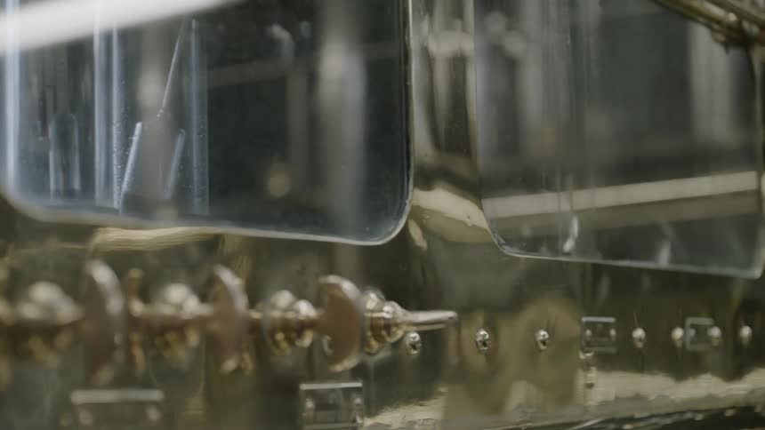 Spouts onside of glass windowed machinery