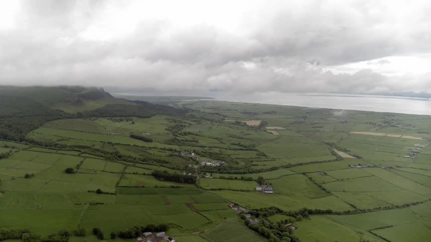 Aerial photography over many fields in a very rural farmland