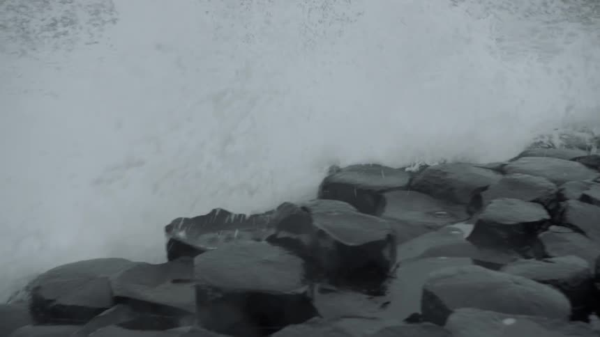 Waves crash on a rocky shoreline