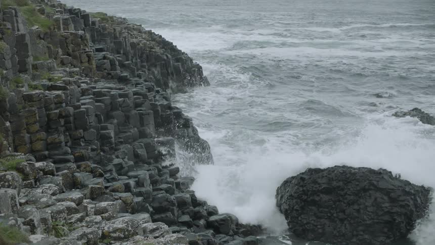 Waves splash against rocks
