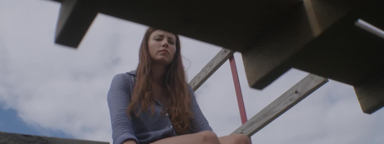 A woman sits on a trailer