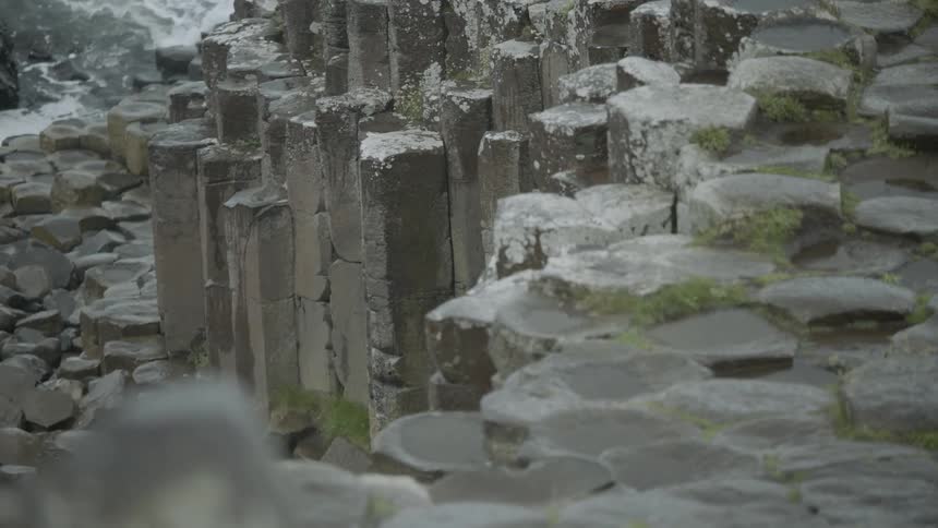 Columns of rock sit next to water