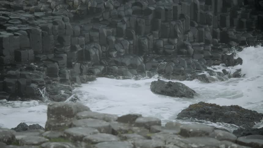 Washes crashing against a rocky shoreline