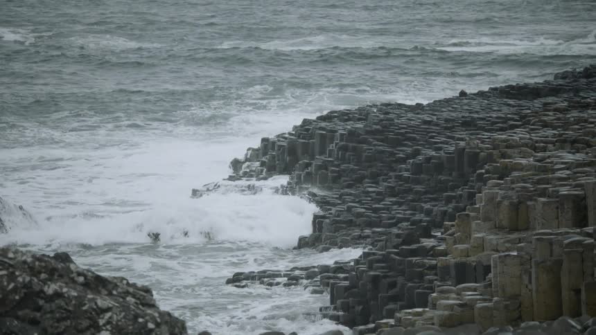 Ocean waves crashing on a rocky shore